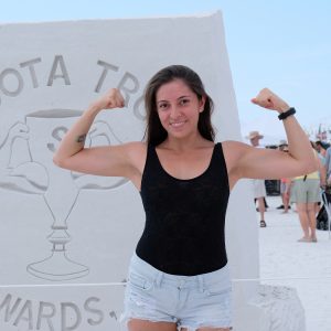 photo gallery girl posing at sand sculpture