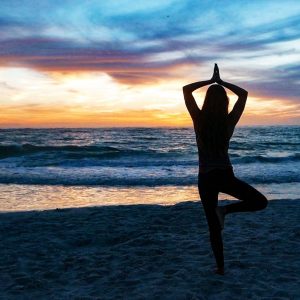photo gallery girl practicing yoga on siesta beach